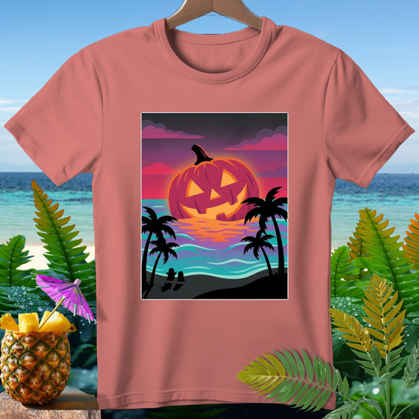 T-shirt featuring a Halloween pumpkin on a beach at sunset with palm trees.