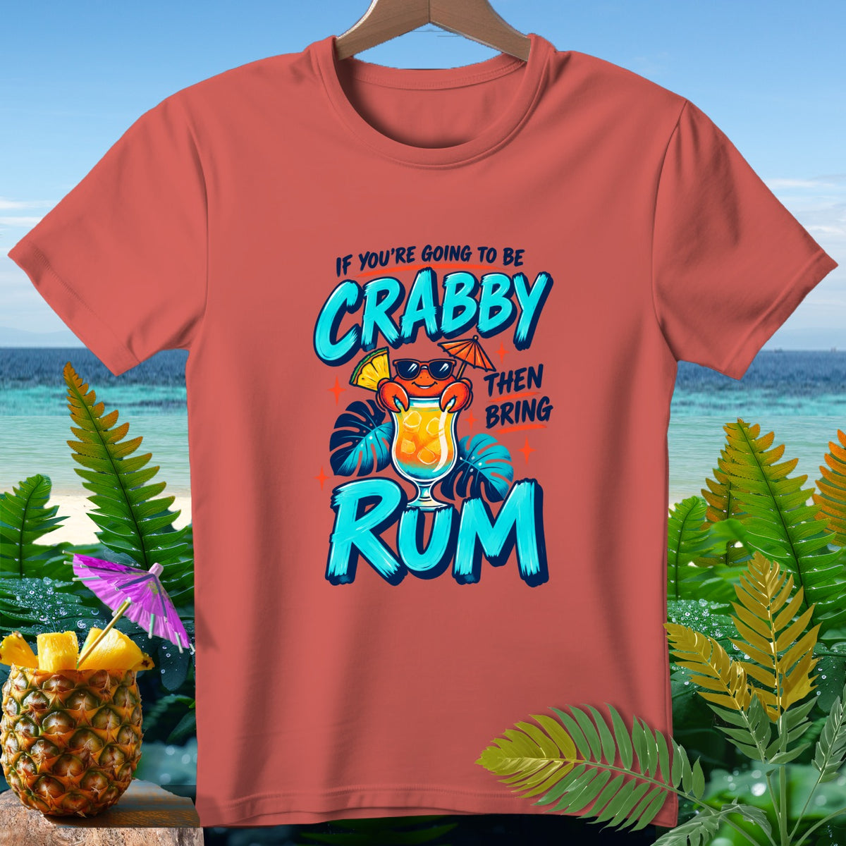 Coral t-shirt with "If You're Going to Be Crabby Then Bring Rum" graphic.