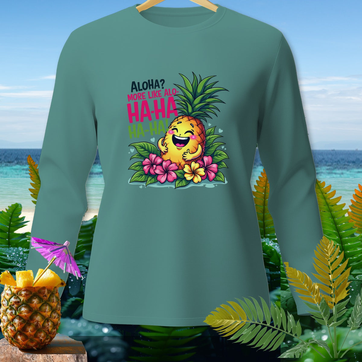 Green long-sleeve shirt with laughing pineapple graphic saying "Aloha? More Like Alo-HA-HA HA-HA".