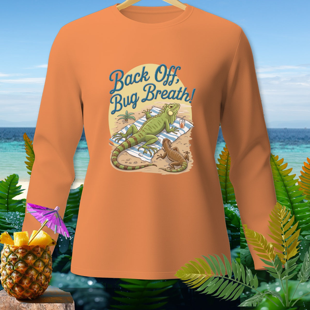 Orange long-sleeve shirt with iguanas on a beach and "Back Off, Bug Breath!" text.