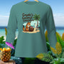 Teal shirt with "Coyote's Coconut Conundrum" text and cartoon fox.