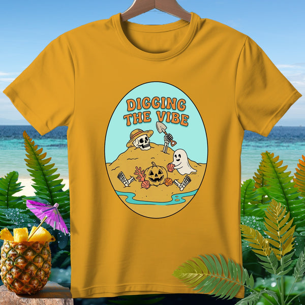 T-shirt with oval graphic of skeleton, ghost, pumpkin, and text "DIGGING THE VIBE".