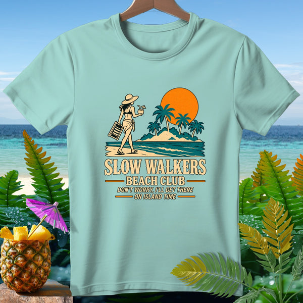 Light blue t-shirt with graphic of woman on beach, text "SLOW WALKERS BEACH CLUB".
