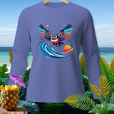 Long-sleeved shirt with a colorful owl graphic over waves and a tropical background.