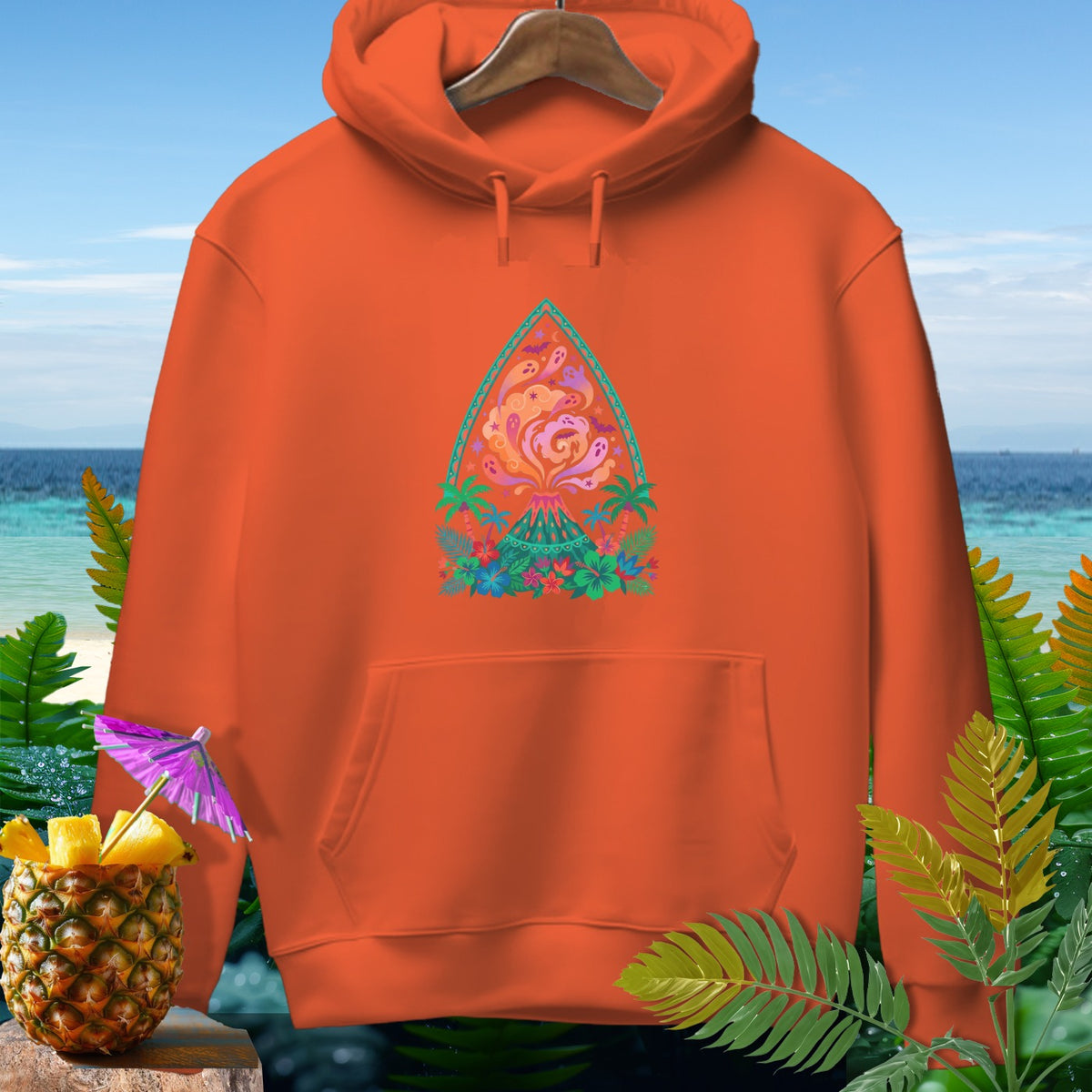 Orange hoodie featuring a colorful volcano eruption design with tropical foliage.