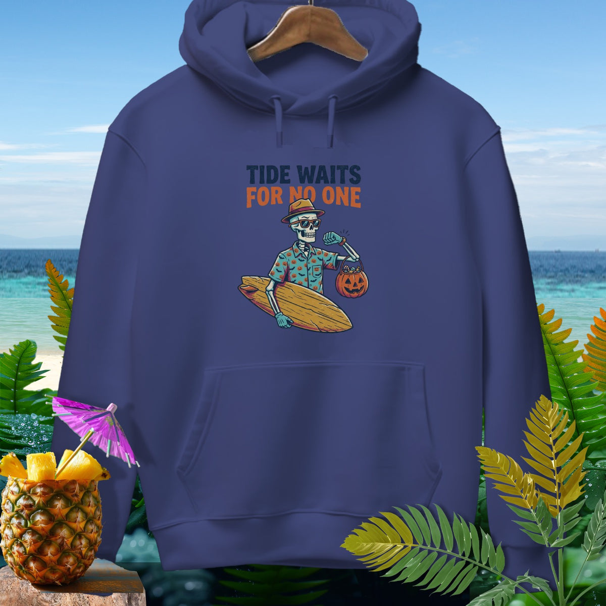Navy hoodie with skeleton surfer graphic and "Tide Waits For No One" text.