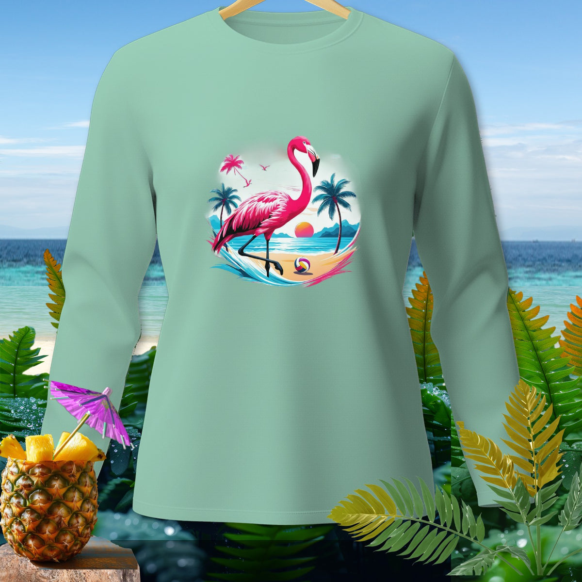 Long sleeve mint shirt with a pink flamingo and beach scene graphic.