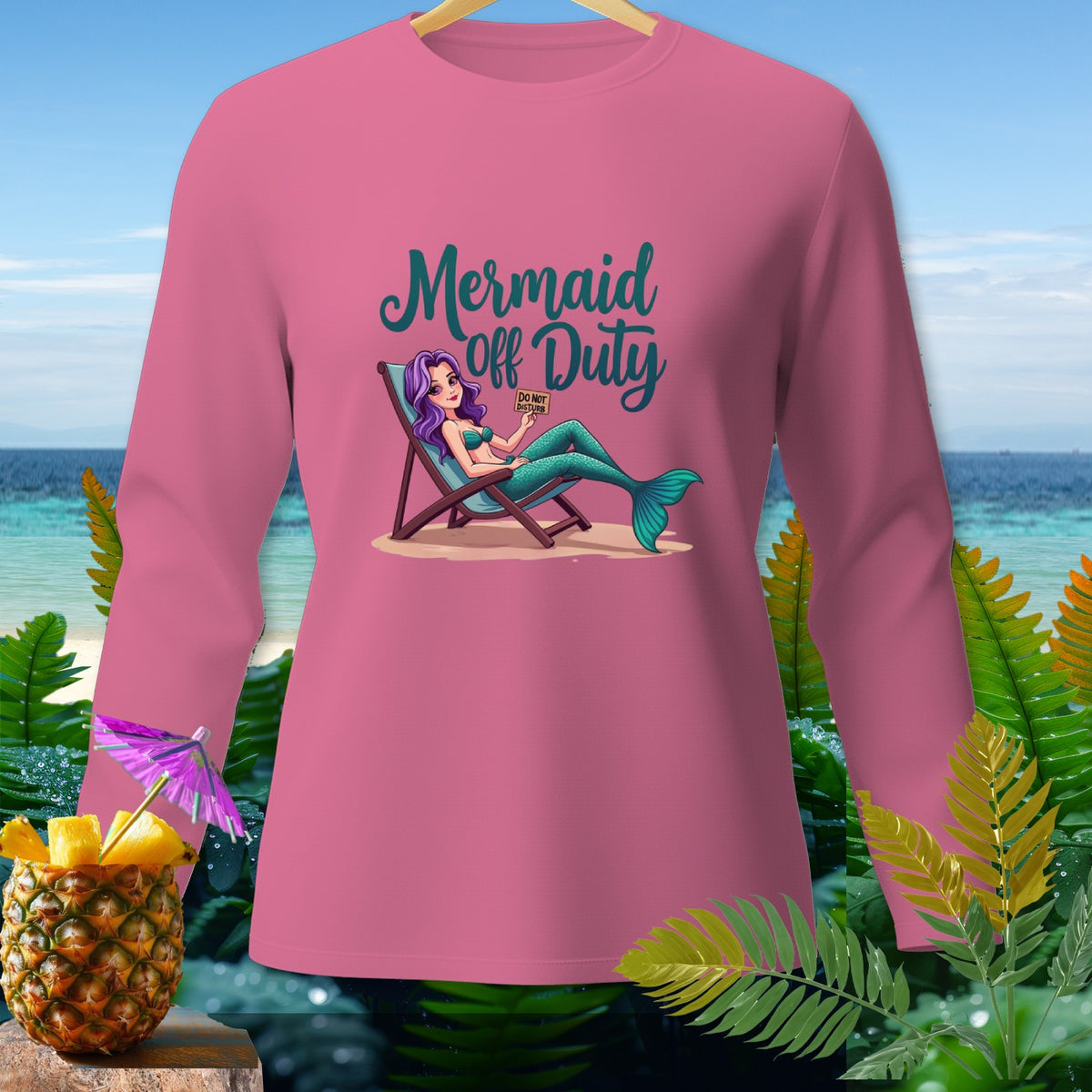 Pink long-sleeve shirt with "Mermaid off Duty" text and mermaid on lounge chair.