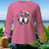 Pink long-sleeve shirt with two cartoon penguins holding a colorful umbrella.