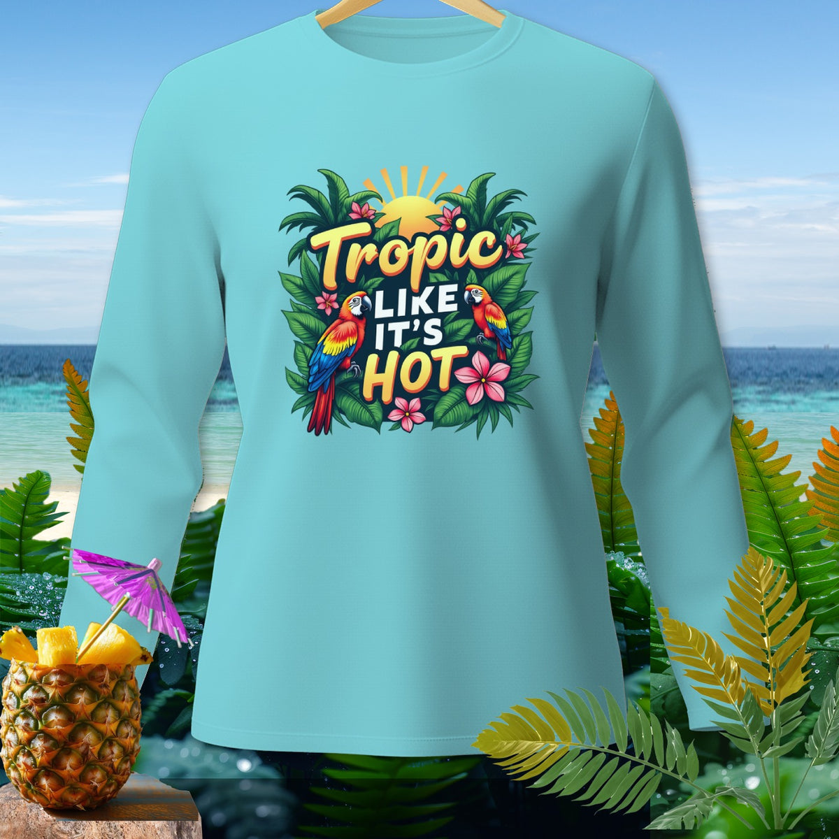Light blue long sleeve shirt with "Tropic Like It's Hot" parrot graphic.