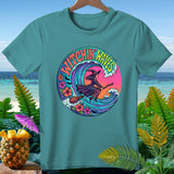 Teal t-shirt with circular graphic of a witch on a broomstick and 