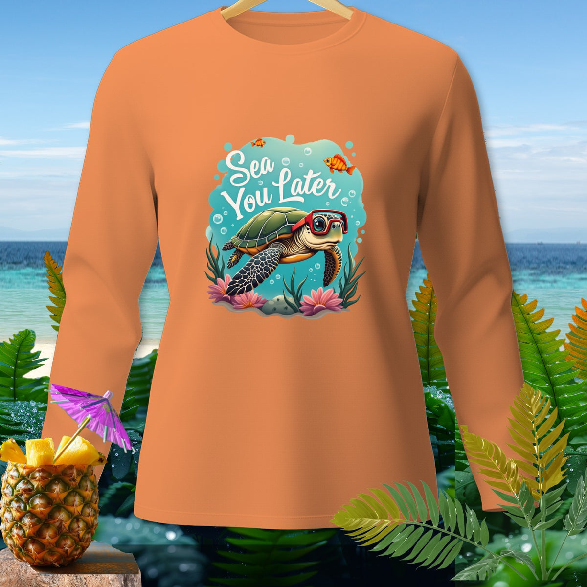 Orange long-sleeve shirt with a sea turtle graphic and text "Sea You Later."
