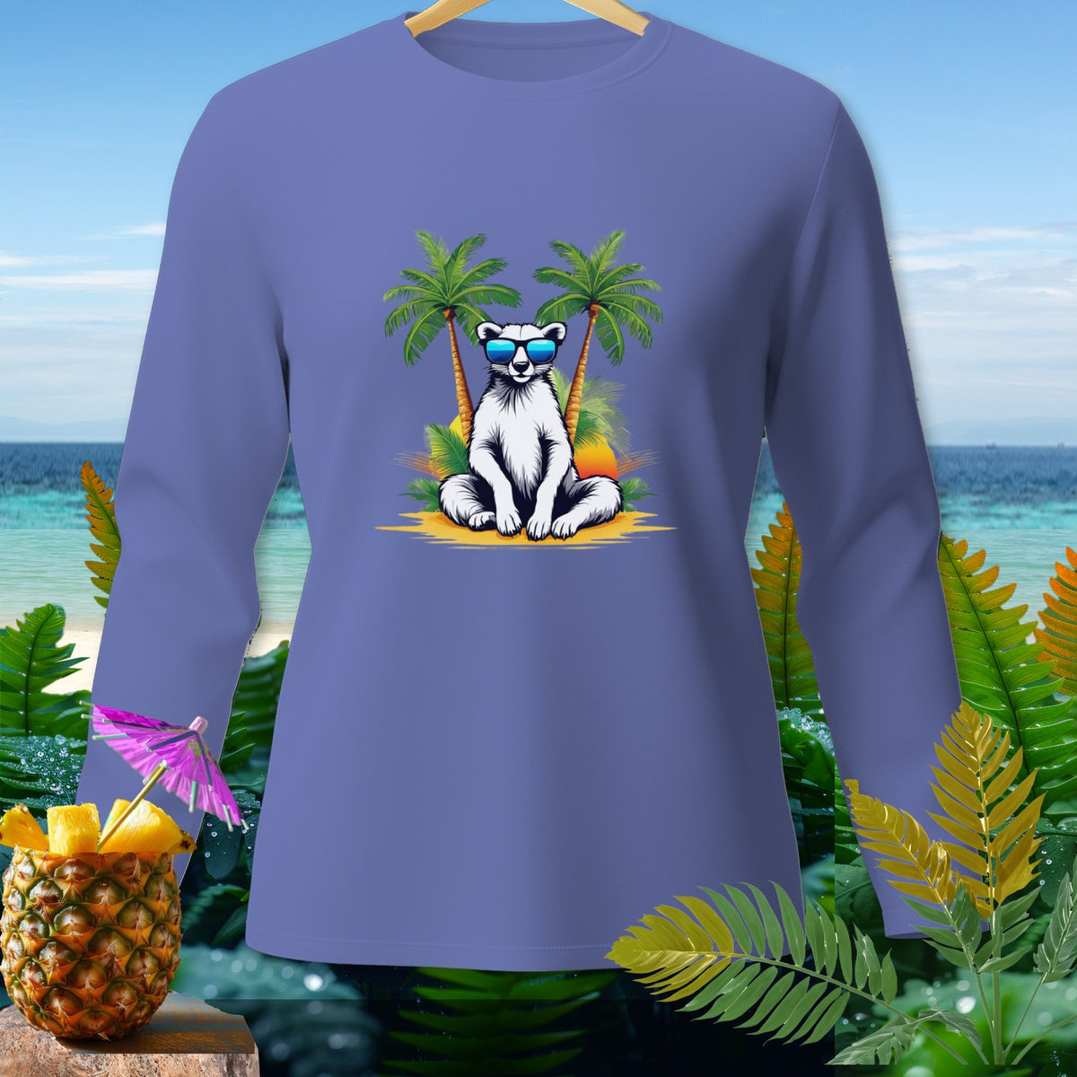 Long sleeve shirt with graphic of a polar bear wearing sunglasses between palm trees on a beach.