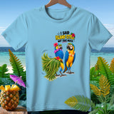 Light blue t-shirt with parrots, a pineapple, and the text 