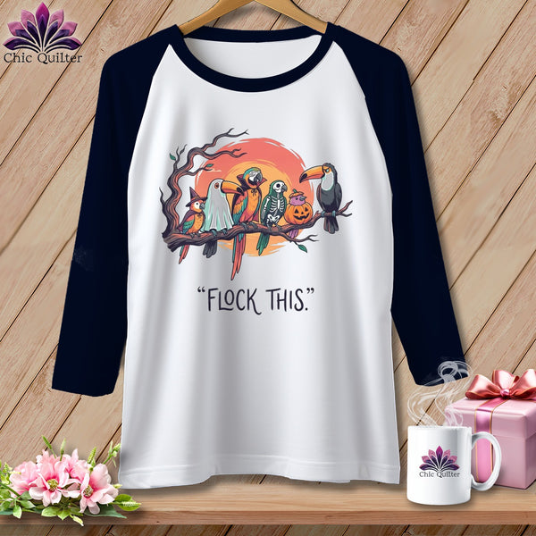 White raglan shirt with Halloween-themed parrots and the text "FLOCK THIS."