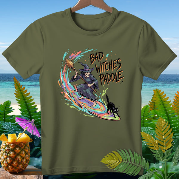 T-shirt with witch on surfboard, black cat, and text "BAD WITCHES PADDLE".