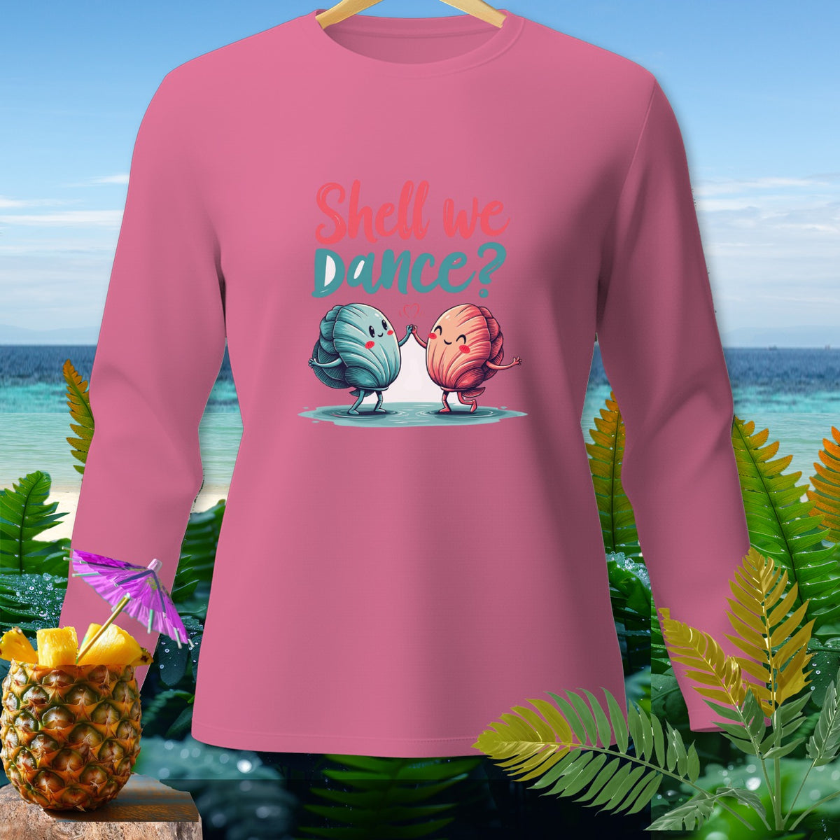 Pink long-sleeve shirt with "Shell we Dance?" text and cartoon seashells dancing.