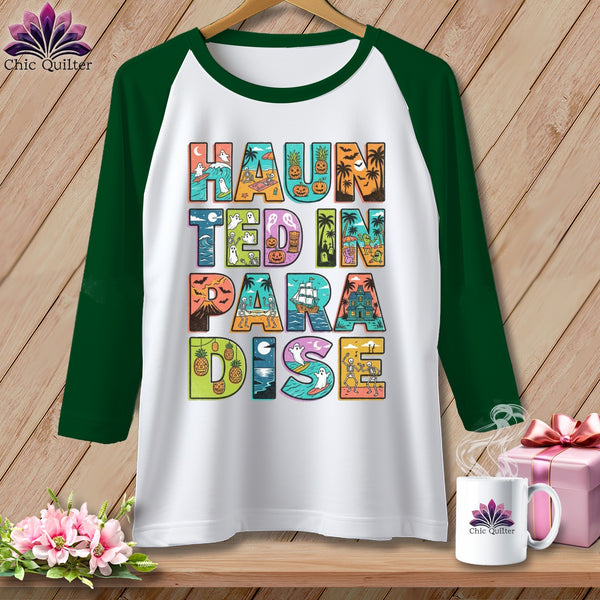 Green and white raglan sleeve t-shirt with "Haunted in Paradise" Halloween graphic.