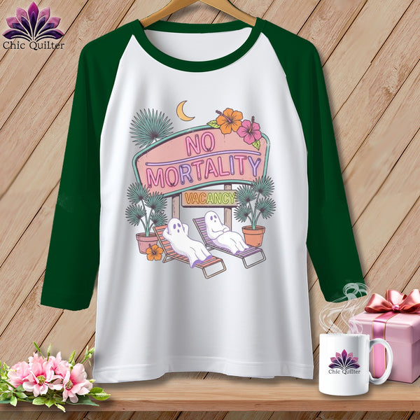 White baseball tee with "No Mortality Vacancy" neon sign and sunbathing ghosts graphic.
