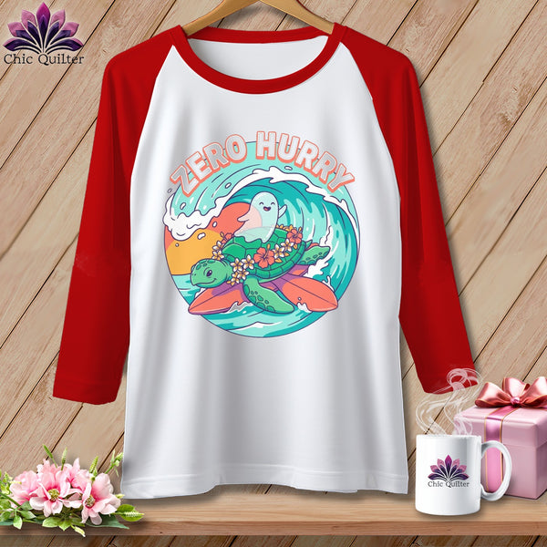 Raglan t-shirt with "Zero Hurry" graphic of a sea turtle surfing.