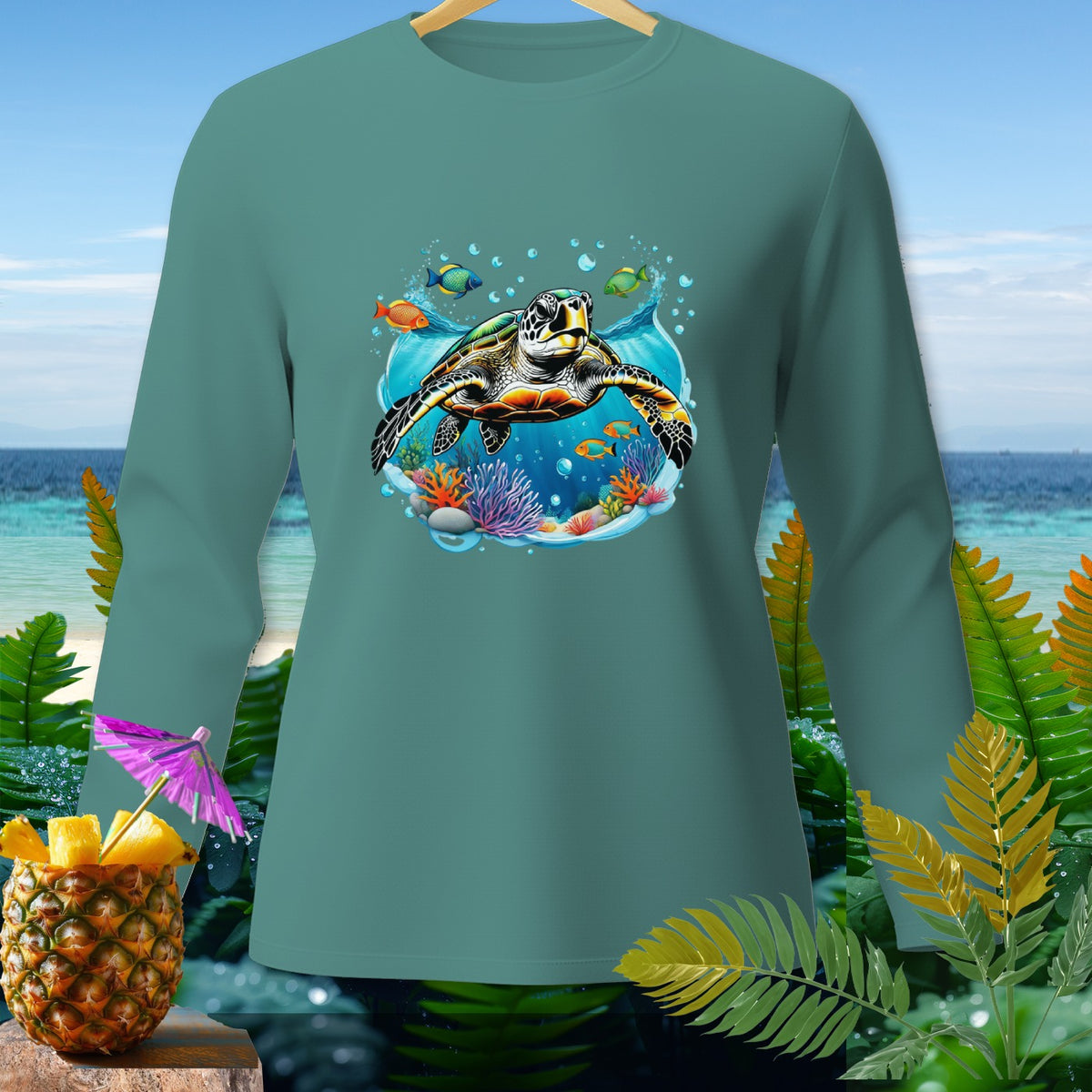 Teal long-sleeve shirt with a sea turtle and coral reef graphic.