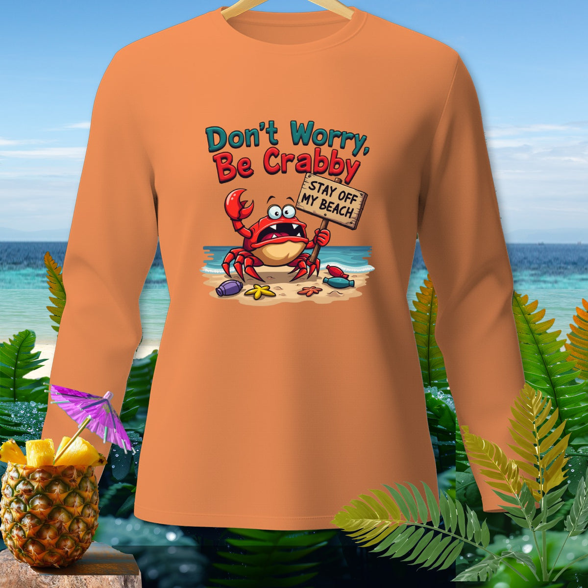 Orange long-sleeve shirt with a crab holding a "Stay Off My Beach" sign.