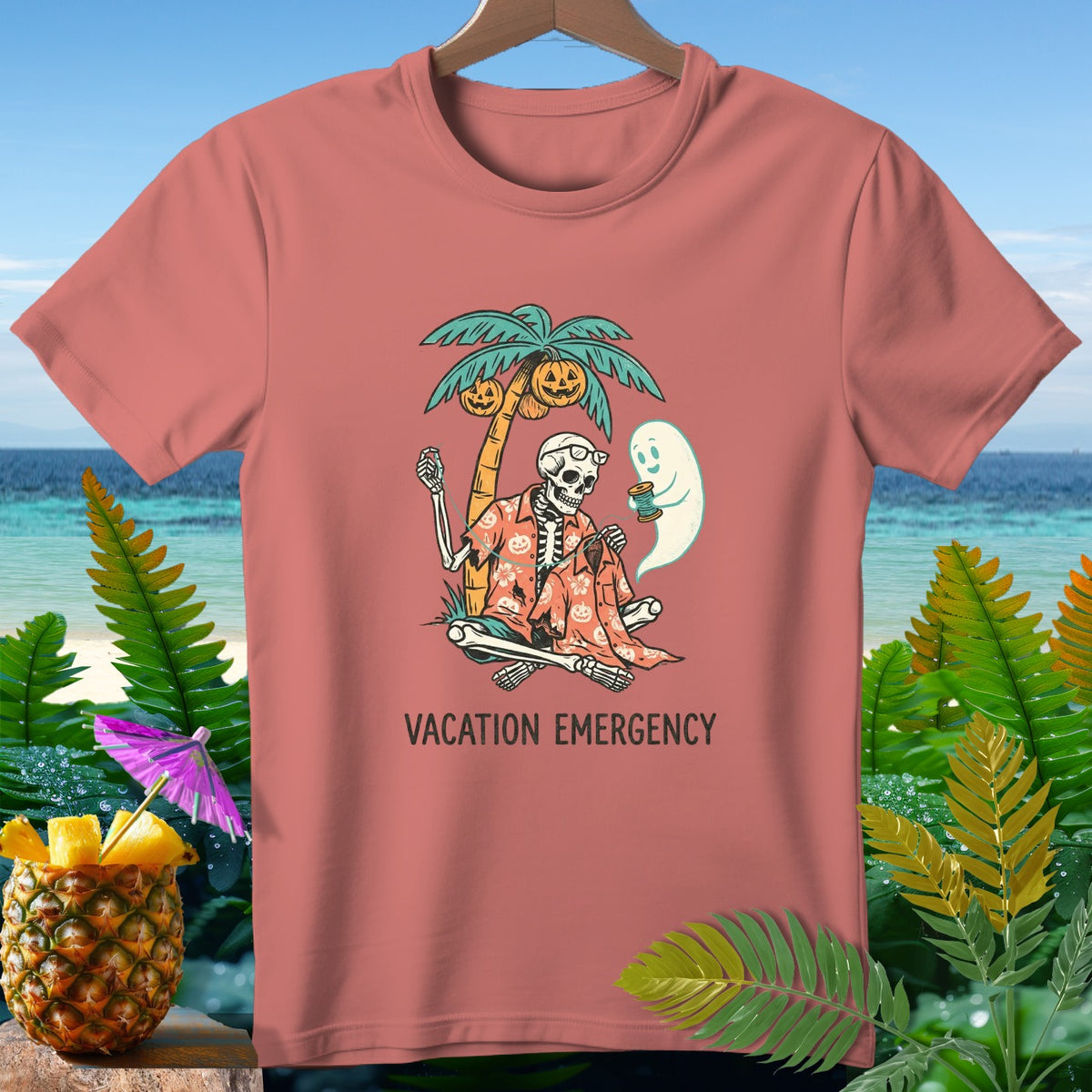 Skeleton and ghost with pumpkins on a palm tree, text "VACATION EMERGENCY".