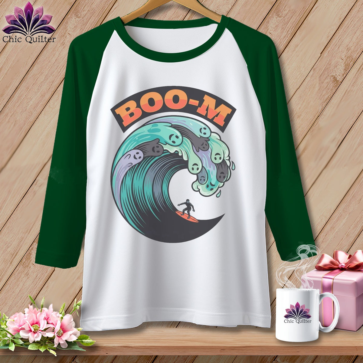White raglan shirt with a graphic of ghosts in a wave and the text "BOO-M".
