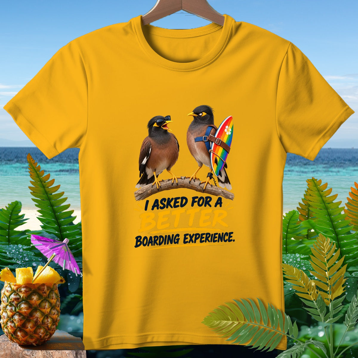 Yellow t-shirt with two birds on a branch, one wearing sunglasses and the other a surfboard.