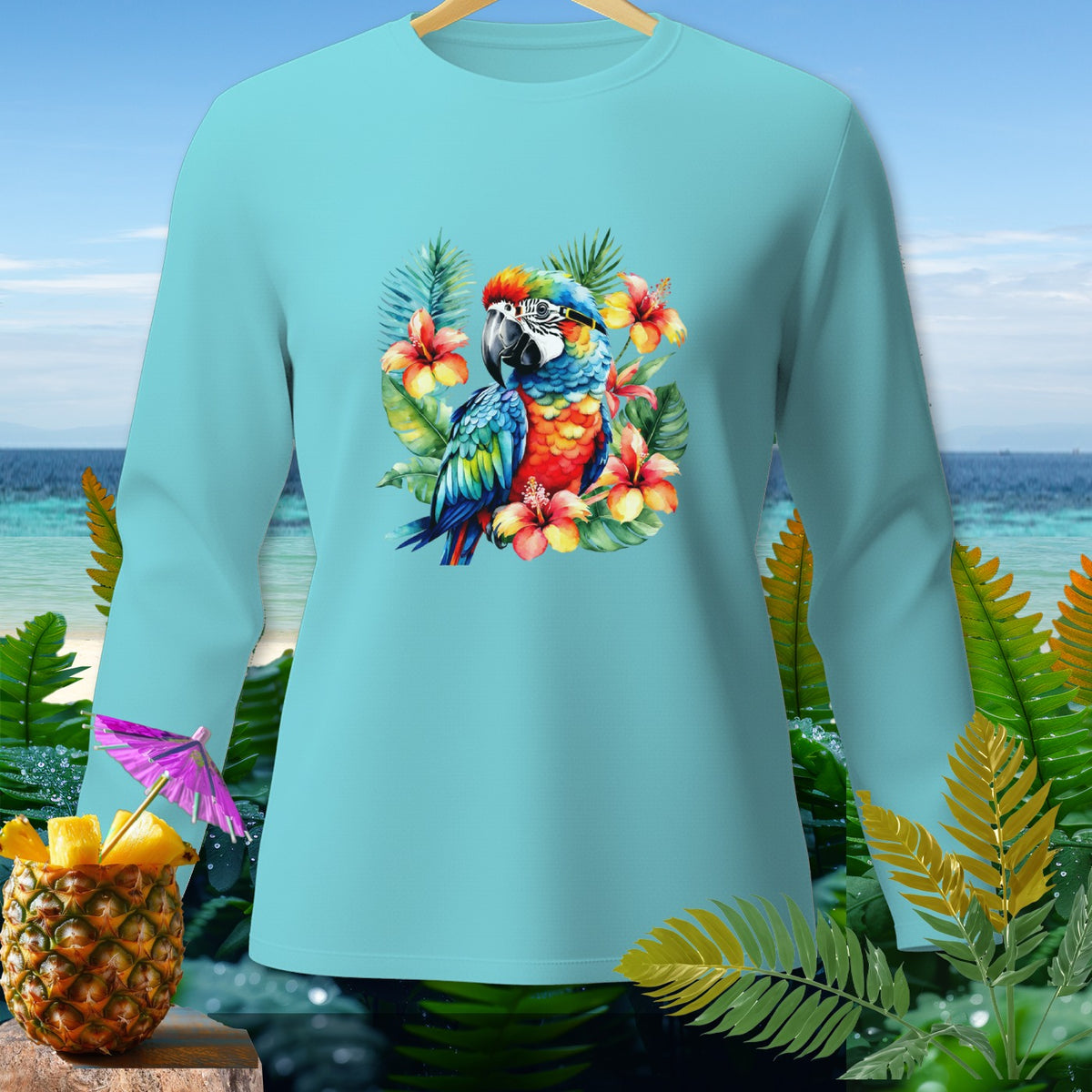 Teal long-sleeve shirt featuring a colorful macaw among hibiscus flowers.