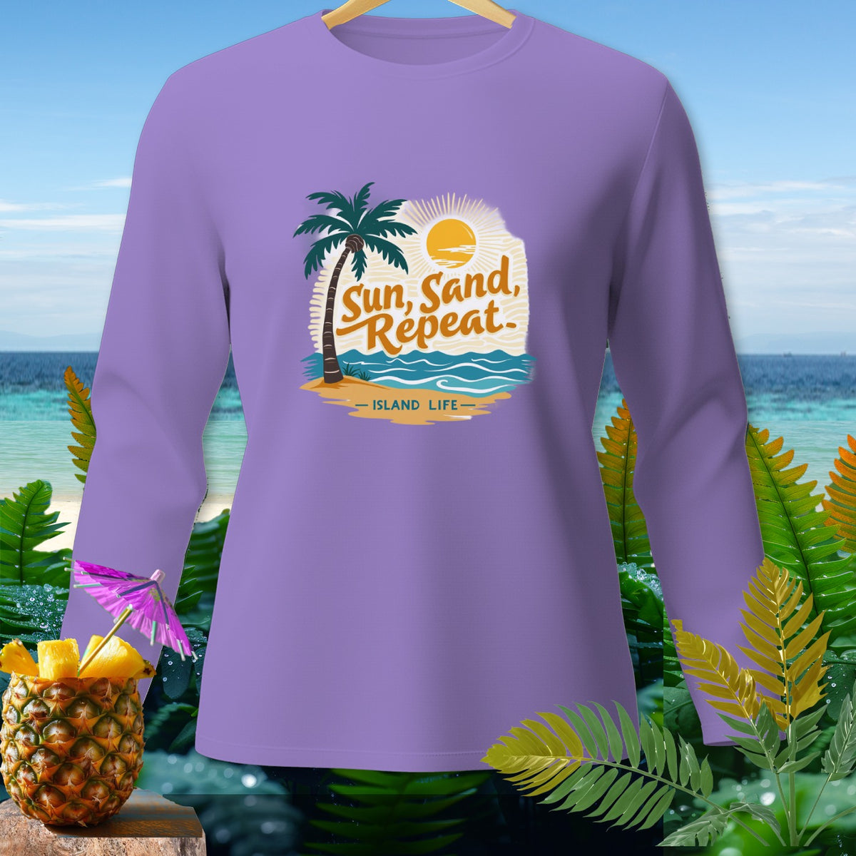 Lavender long-sleeve shirt with "Sun, Sand, Repeat - Island Life" graphic.