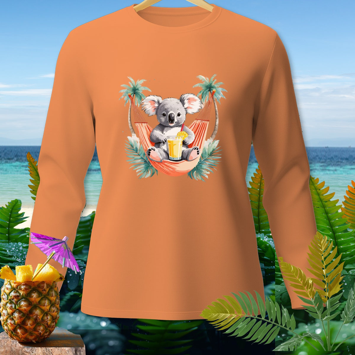 Orange long-sleeve shirt with a koala in a hammock and a pineapple drink.
