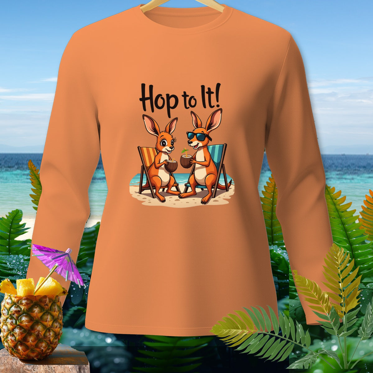Orange long-sleeve shirt with "Hop to It!" and two kangaroos with drinks on the beach.