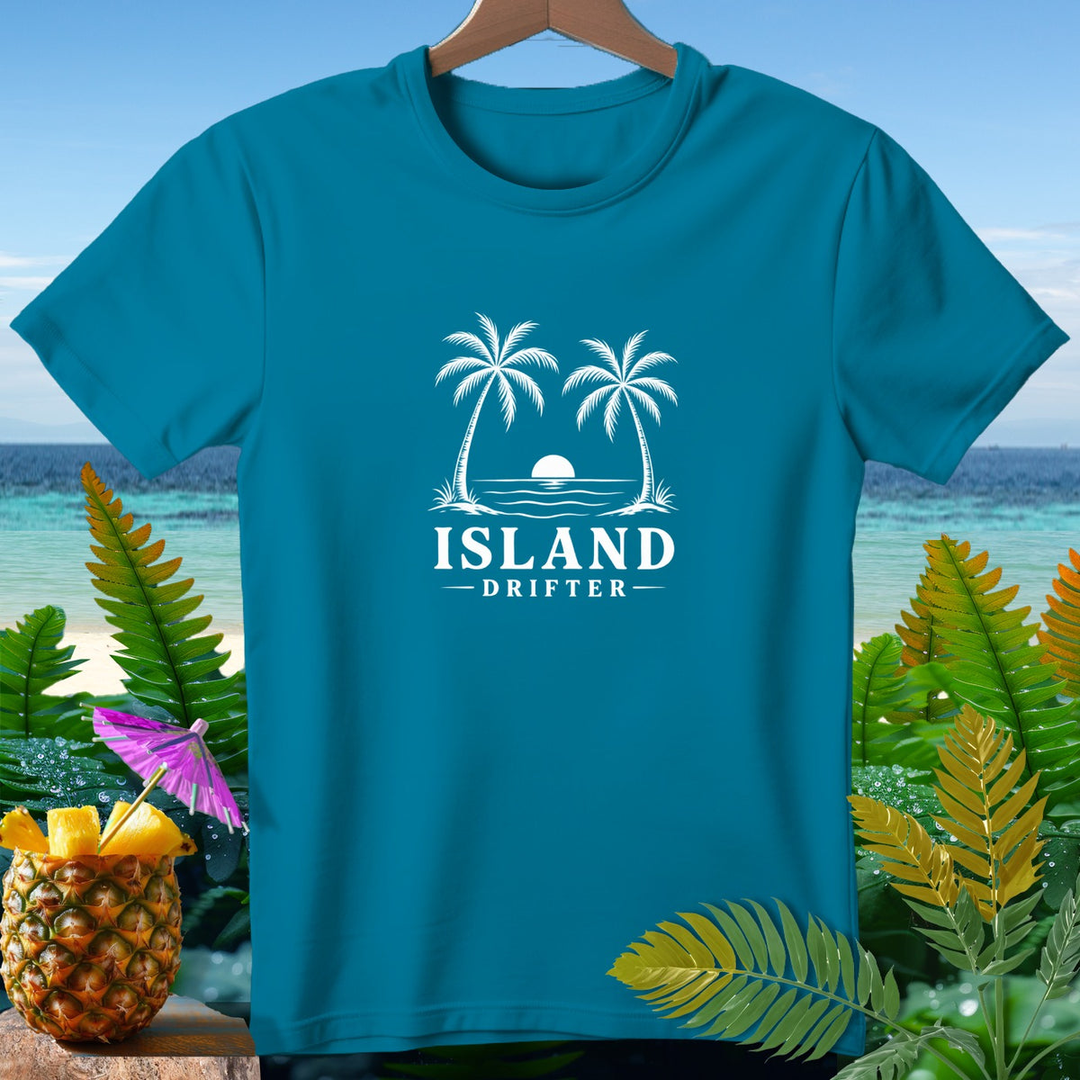 Teal t-shirt with white "Island Drifter" text and palm trees graphic.