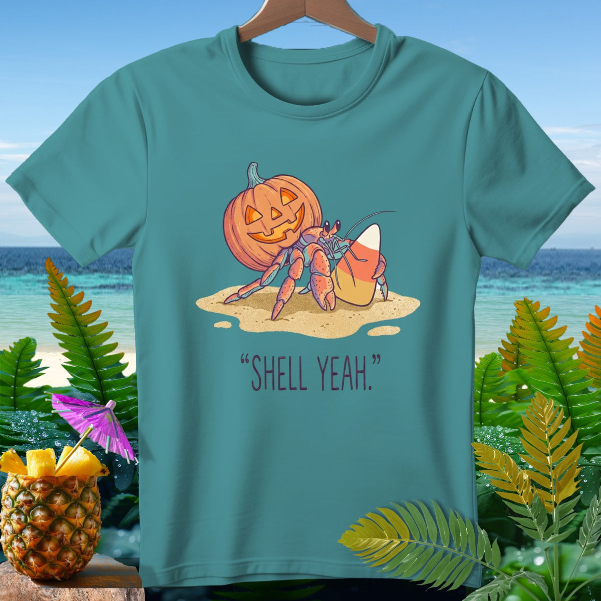 Hermit crab with pumpkin and candy corn, text "SHELL YEAH."