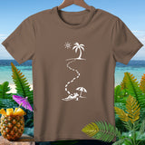 Brown t-shirt with white graphic of footprints leading to a person relaxing on a beach.
