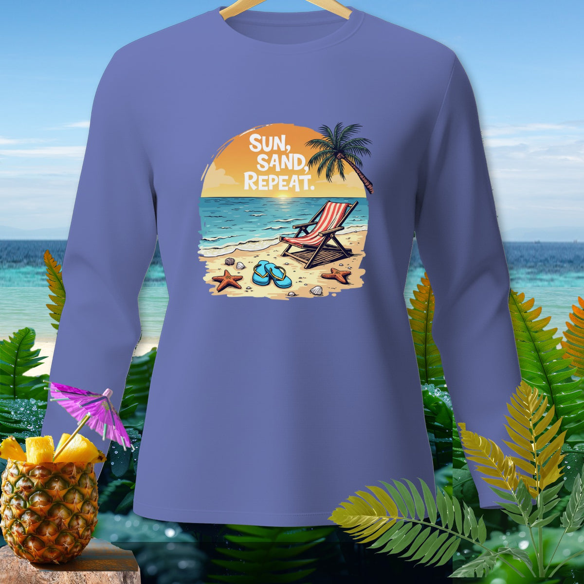 Purple long sleeve shirt with beach graphic and text "Sun, Sand, Repeat".