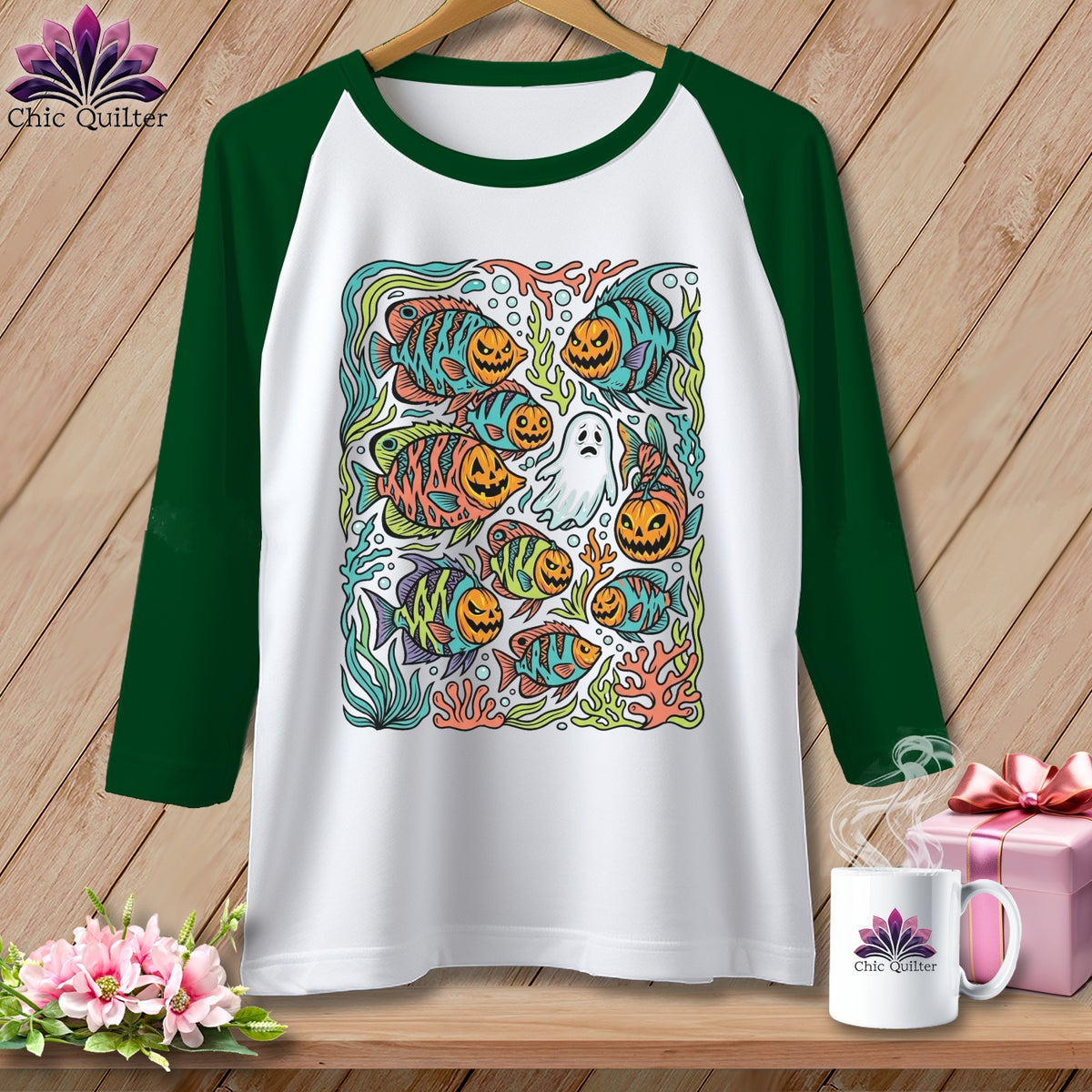 Raglan sleeve shirt with Halloween fish and pumpkin faces graphic.