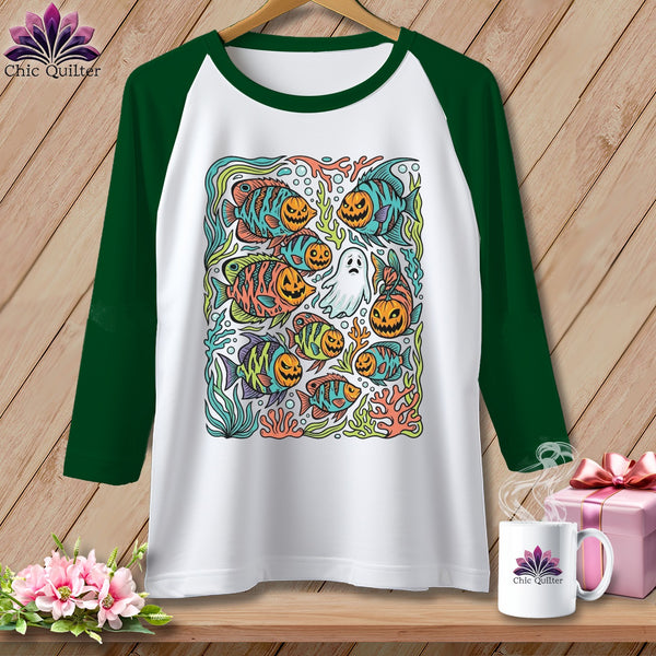 Raglan sleeve shirt with Halloween fish and pumpkin faces graphic.