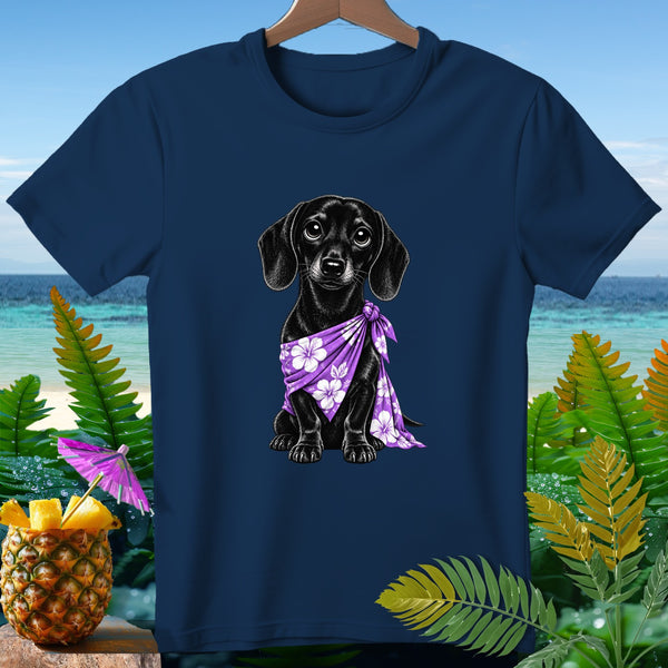 Black dachshund wearing a purple floral scarf on a navy blue t-shirt.