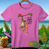 Pink t-shirt with sloth hanging from branch, flowers, and text 