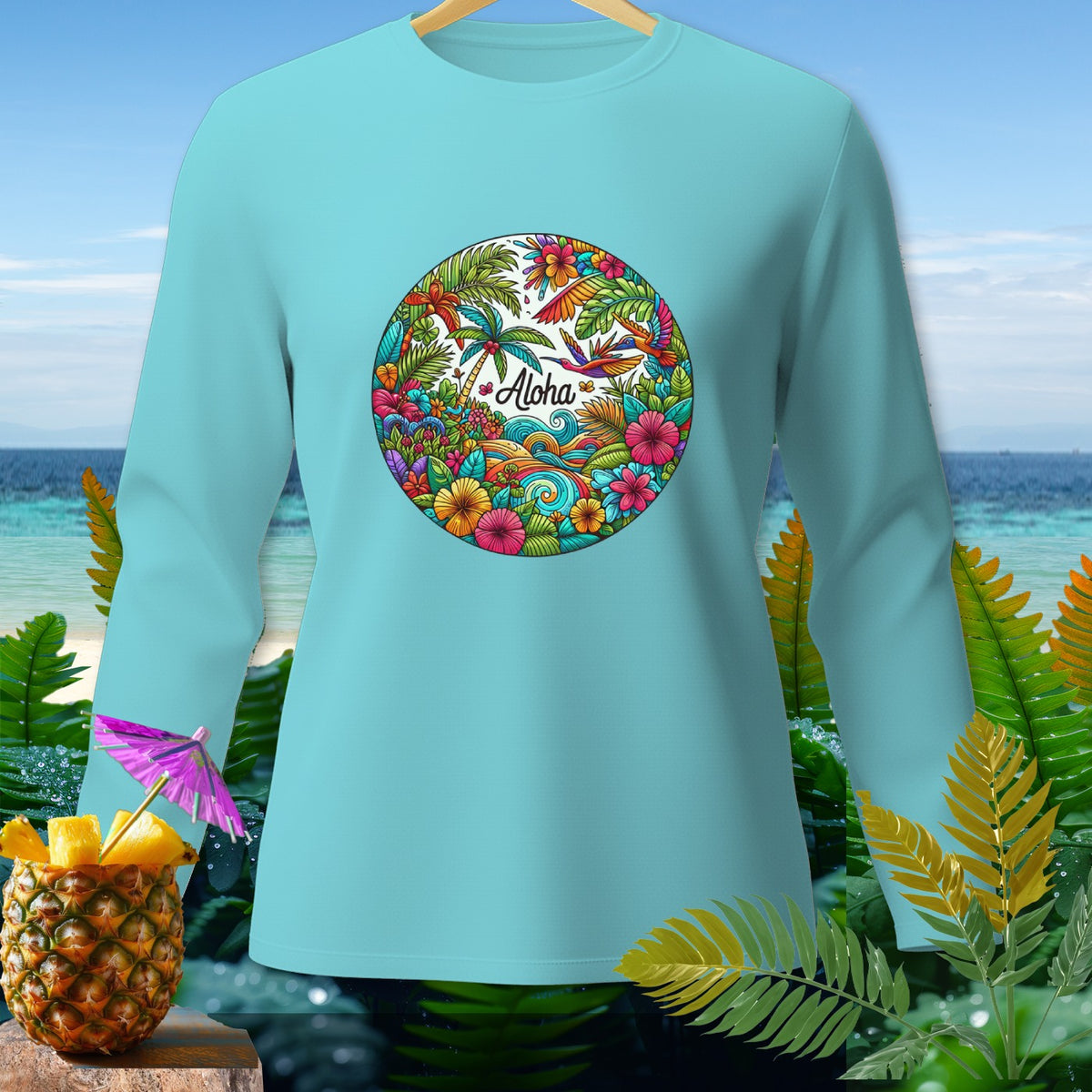 Light blue long-sleeve shirt with circular tropical scene and "Aloha" text.