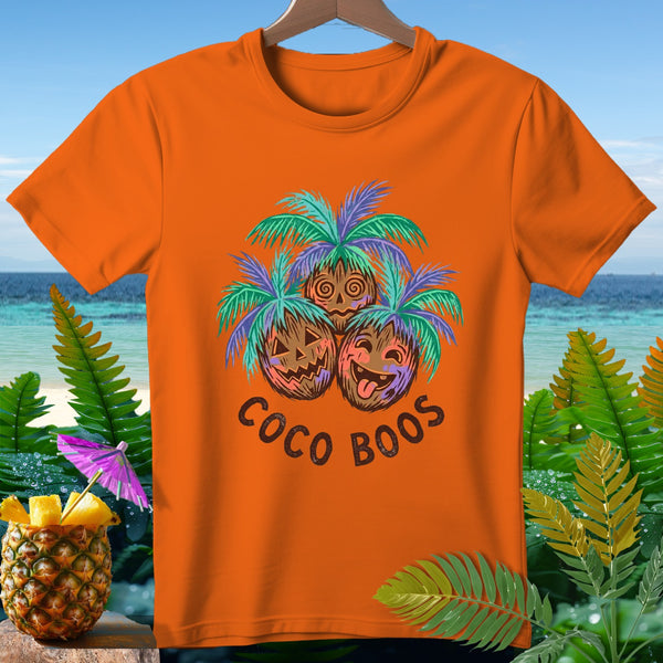Orange t-shirt with three coconut faces under palm leaves, reading "COCO BOOS".