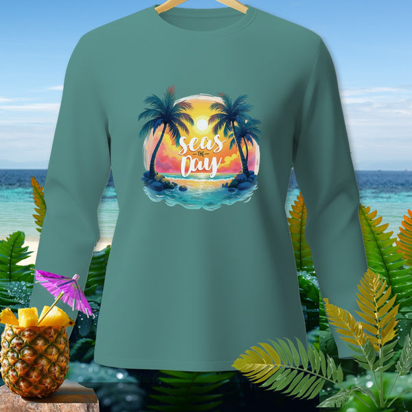 Teal long-sleeve shirt with a tropical sunset graphic and text "Seas the Day".