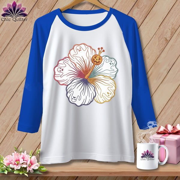 White baseball tee with colorful hibiscus and ghosts design, and "Chic Quilter" logo.