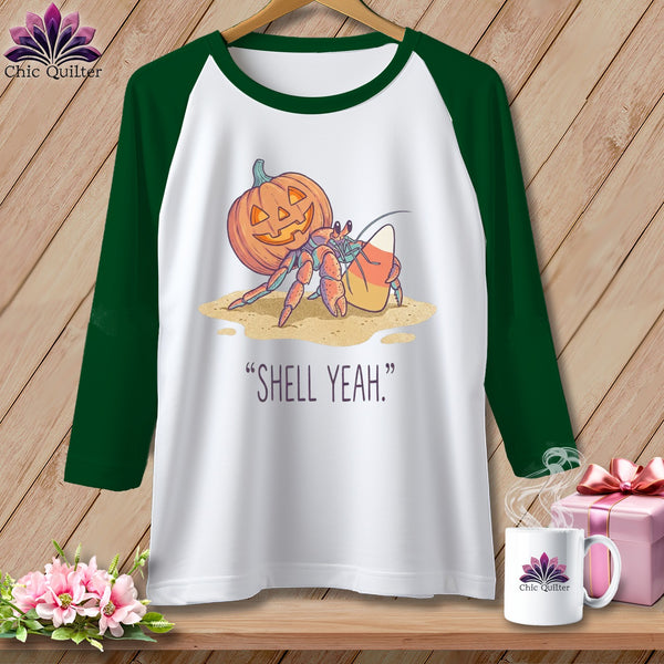 Hermit crab with pumpkin and candy corn, text reads "SHELL YEAH."
