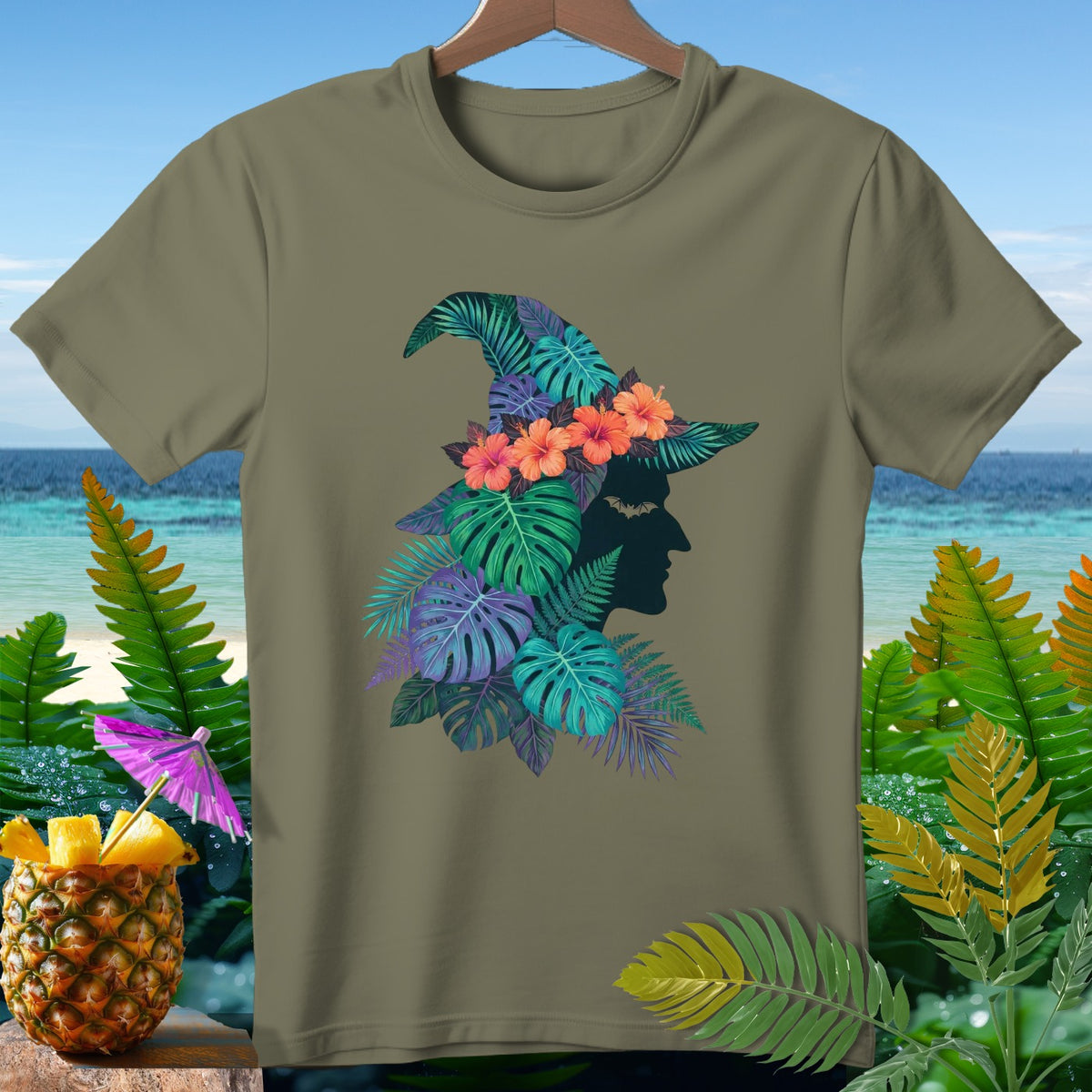 Olive green t-shirt with tropical witch silhouette and hibiscus flowers.