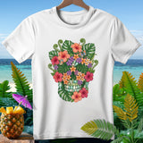 White t-shirt with tropical floral skull design and ocean background.