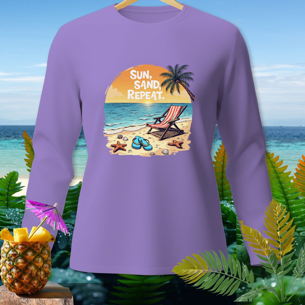 Purple long sleeve shirt with beach graphic and text "SUN, SAND, REPEAT."