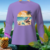 Purple long sleeve shirt with beach graphic and text 